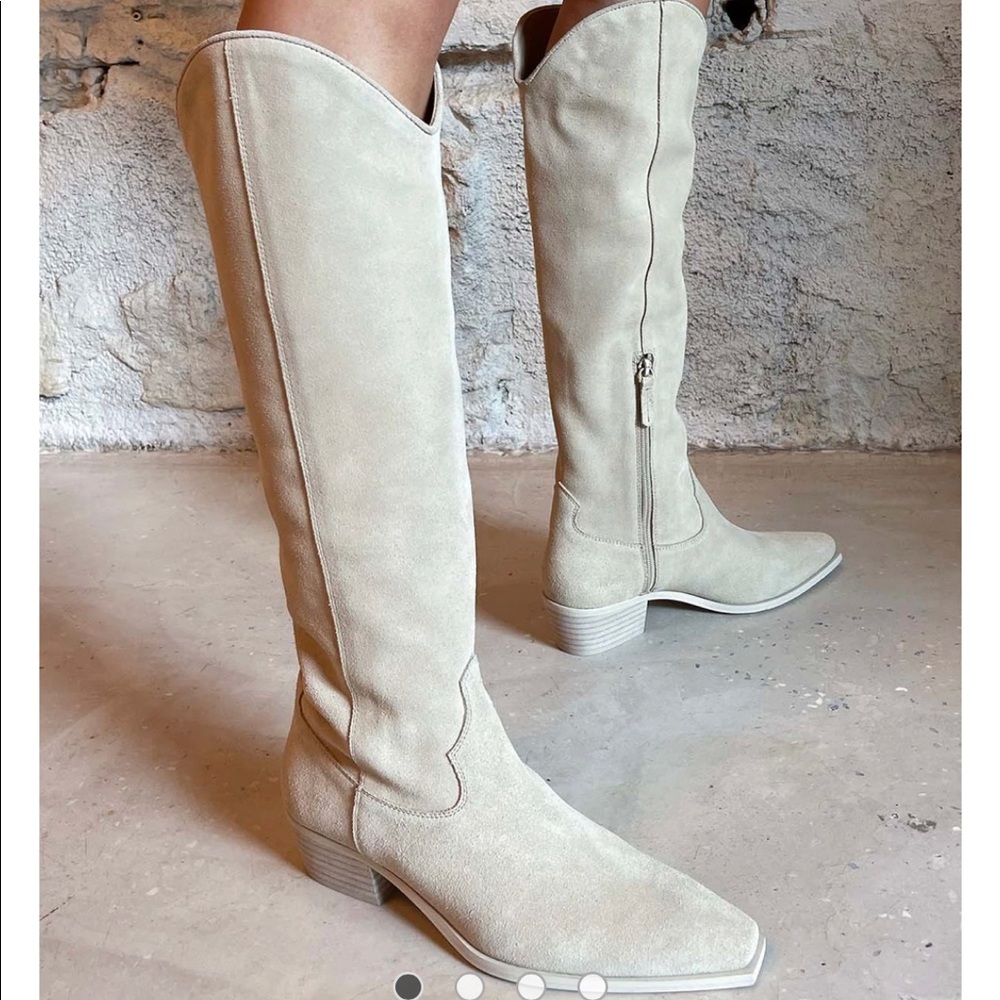 Knee high ivory colored suede boots